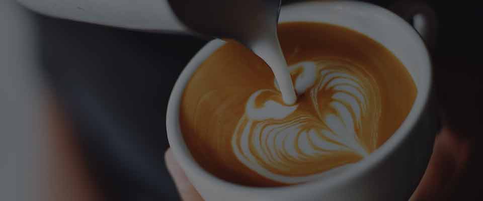 person pouring latte art